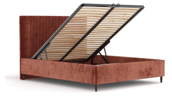 Čalouněná dvoulůžková postel v cihlové barvě s úložným prostorem s roštem 180x200 cm Etero – Maison de Rêve