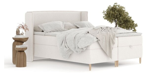 Krémová boxspring postel s úložným prostorem 180x200 cm Monpelli – Maison de Rêve