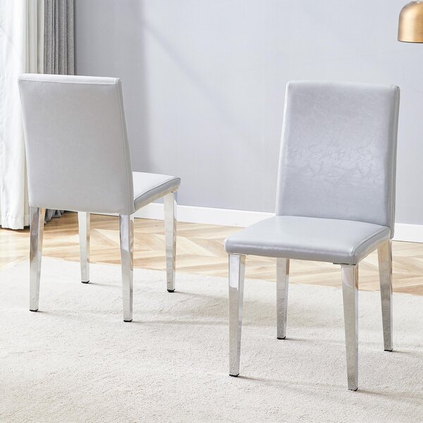 Sada dvou jídelních židlí, minimalistický design, potažené umělou kůží (PU), strukturovaný povrch, kovové nohy (světle šedá, stříbrná)