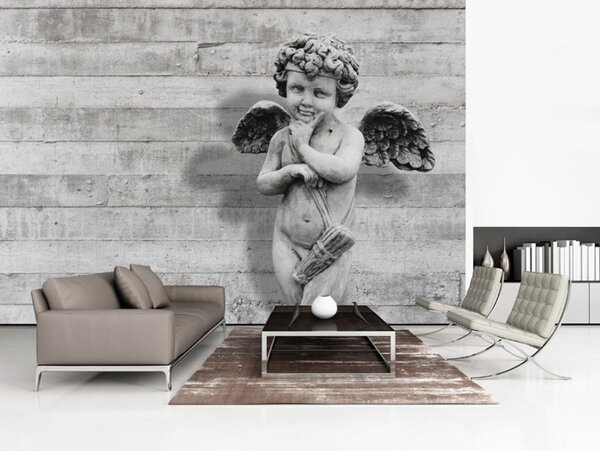 Fototapeta Rozkošný kamenický cherubínek - socha anděla na betonovém