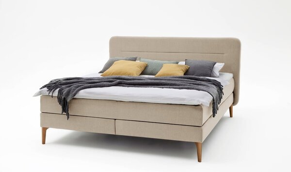 Béžová čalouněná dvoulůžková postel s matrací Meise Möbel Massello, 180 x 200 cm