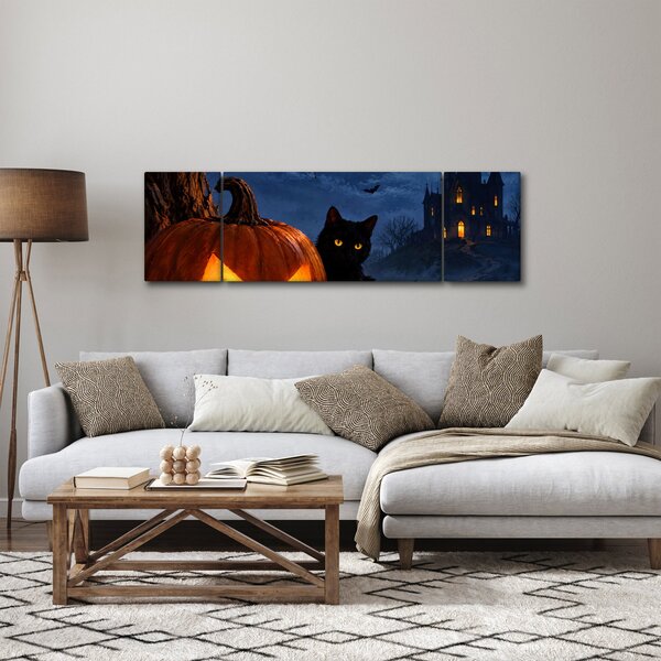Obraz - Černá kočka u svítící dýně na Halloween (170x50 cm)