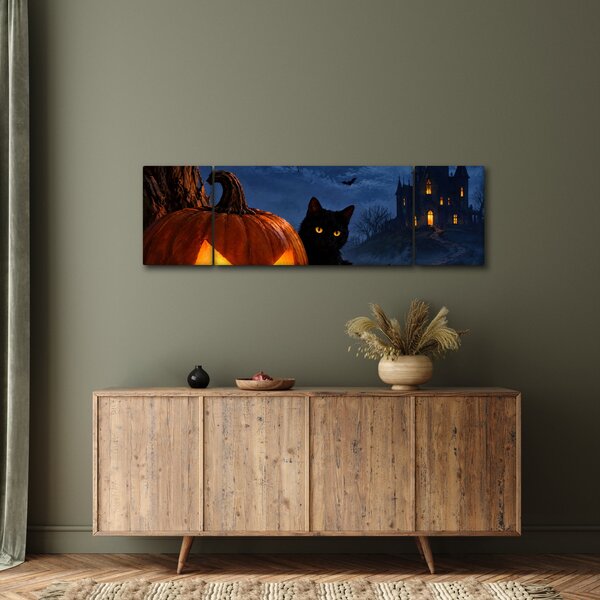 Obraz - Černá kočka u svítící dýně na Halloween (170x50 cm)