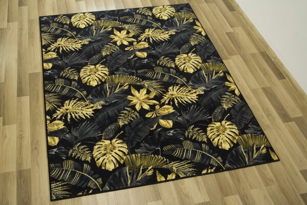 Kobercový ráj Kusový koberec Monstera Listy palmy černý zlatý Rozměr: 100x150 cm