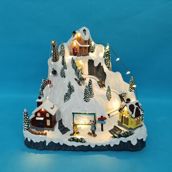 Vánoční vesnička s osvětlením a melodií – lyžování BestBerg BBXS-1001 / 30,5 x 24 x 28,5 cm