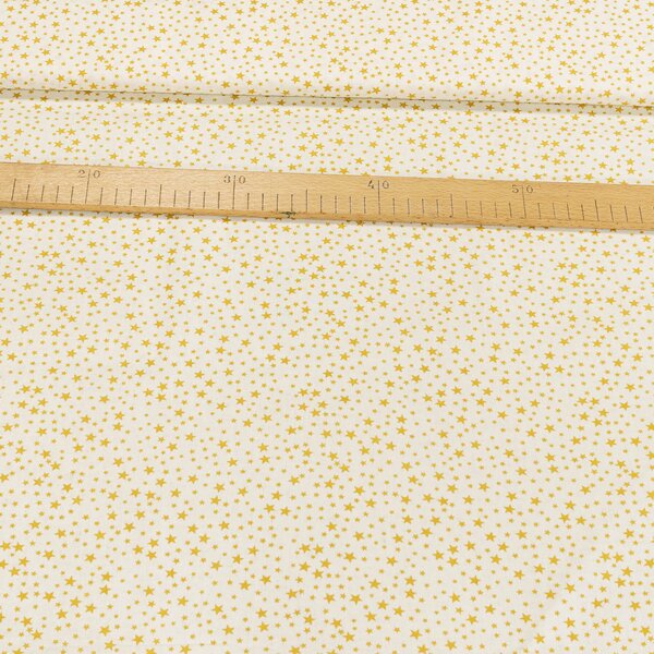 Bavlněné plátno POLO zlaté hvězdičky, š.140cm (látka v metráži)