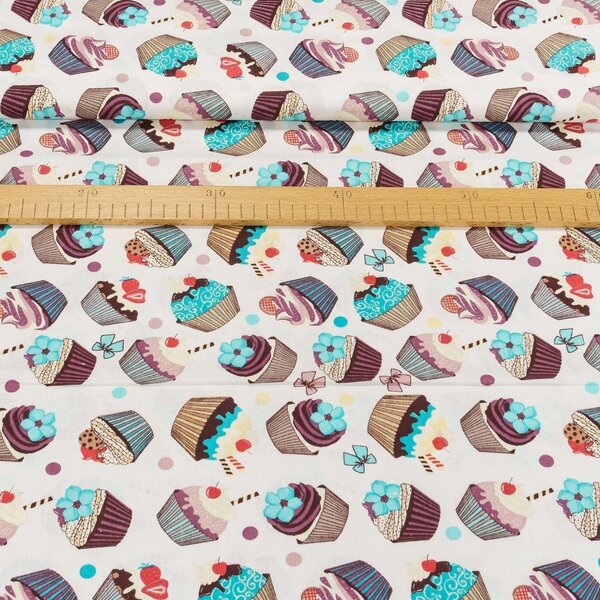Bavlněné plátno EMA modré, růžové a hnědé muffiny na bílé, š.140cm (látka v metráži)