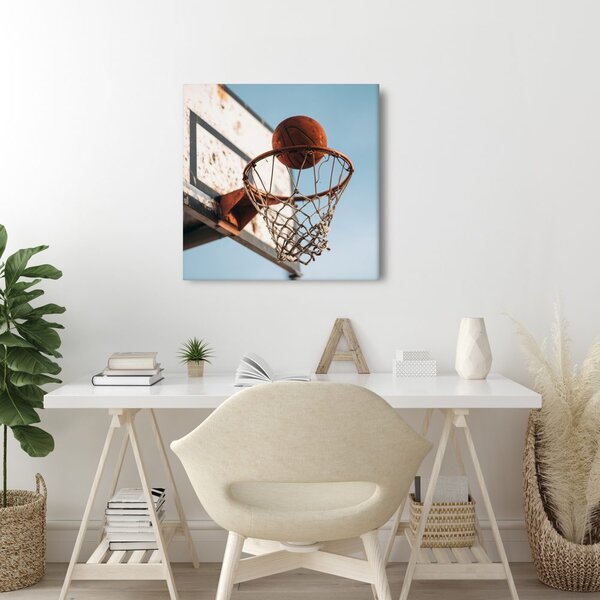 Obraz míč dopadající do basketbalového koše