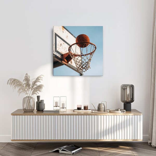 Obraz míč dopadající do basketbalového koše