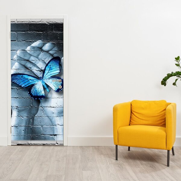 Fototapeta na dveře - Modrý motýl na zdi (95x205cm)