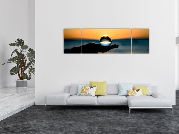 Obraz skleněné koule v dlani (170x50 cm)