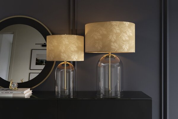 Designová glamour noční lampa Gambier se zlatým stínítkem se vzorem palmových listů a průhlednou skleněnou nohou 47 cm