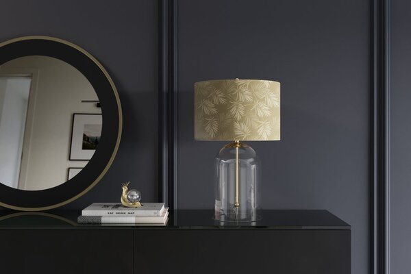 Designová glamour noční lampa Gambier se zlatým stínítkem se vzorem palmových listů a průhlednou skleněnou nohou 47 cm