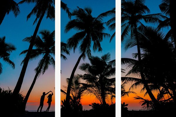 Silueta páru mezi palmami při západu slunce – Třídílný obraz A, 90 × 60 cm