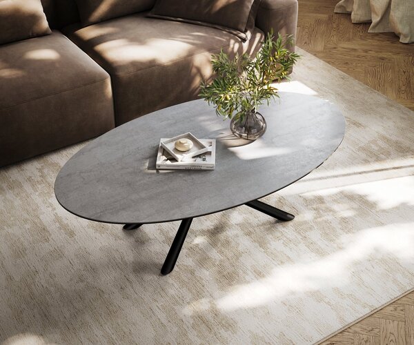 DELIFE Konferenční stolek Edge oválný 140×80 cm keramika beton šedá Sarity kov černá