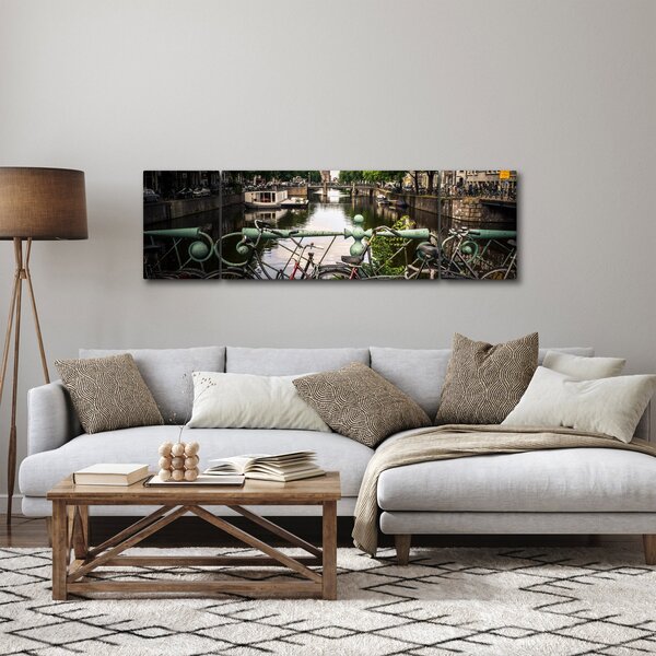 Obraz kola ve městě (170x50 cm)