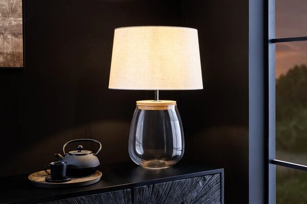 Stylová skleněná stolní lampa Clasico s nohou v podobě průsvitné nádoby s válcovým béžovým stínítkem 60 cm