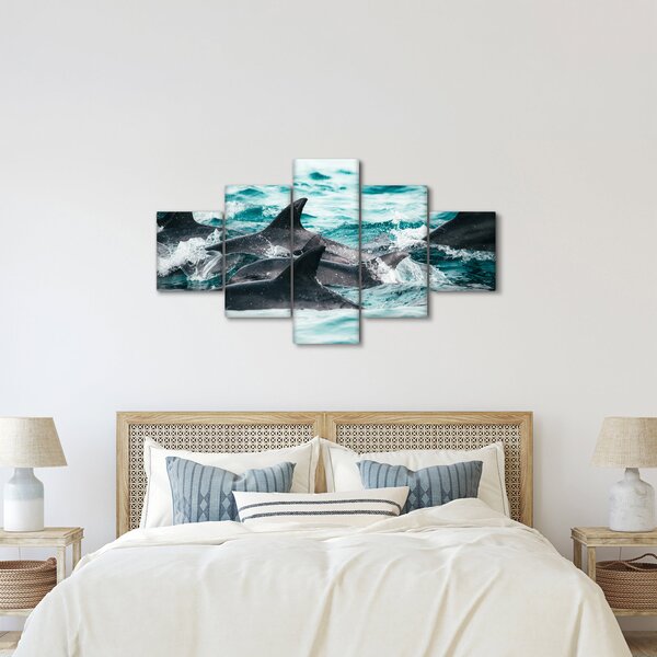 Obraz - Delfíni v oceáně (125x70 cm)