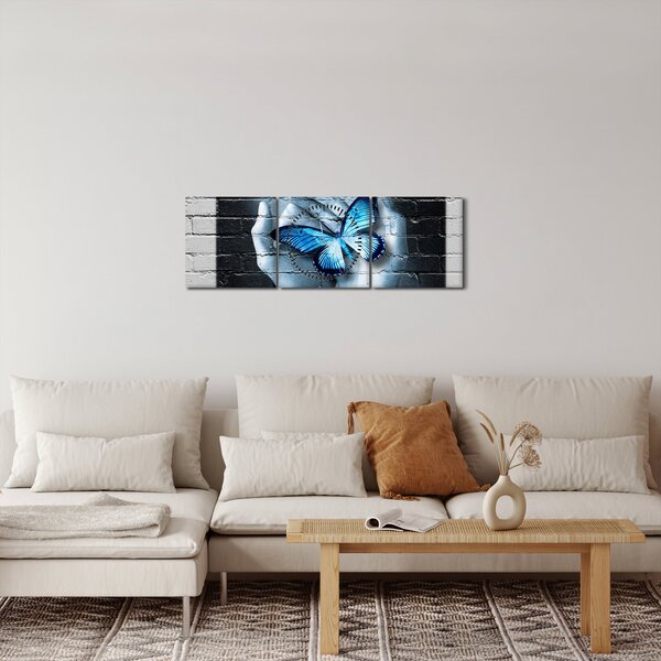 Obraz modrého motýla na zdi (s hodinami) (90x30 cm)
