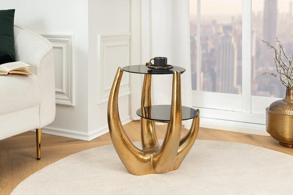 Glamour dvojitý kulatý kovový zlatý příruční stolek Kalan se dvěma vrchními skleněnými šedými deskami s atypickou nohou 50 cm