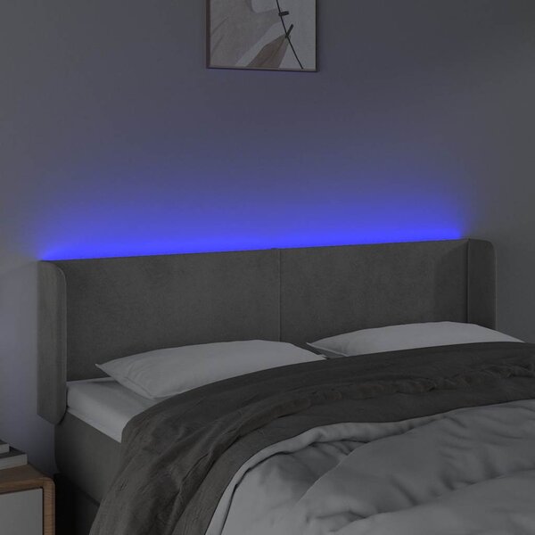 Čelo postele s LED světle šedé 147 x 16 x 78/88 cm samet 3123004
