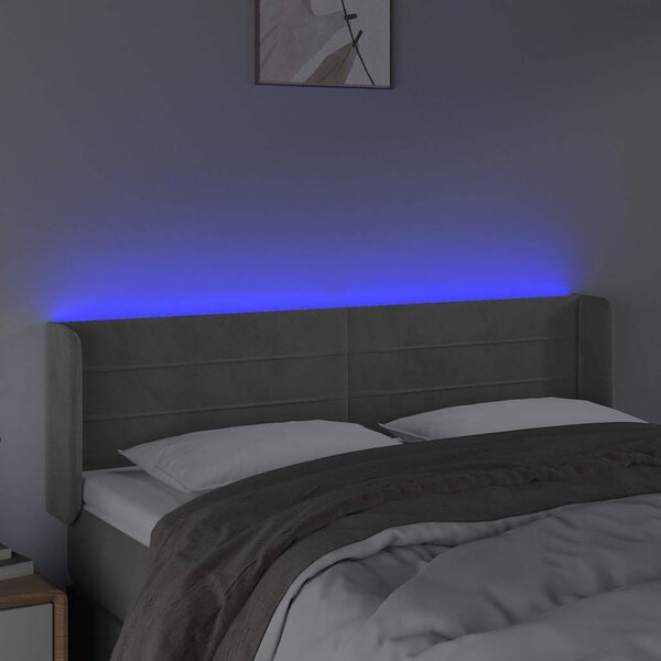 Čelo postele s LED světle šedé 147 x 16 x 78/88 cm samet 3123424