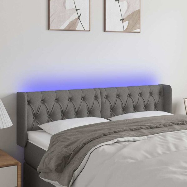 Čelo postele s LED tmavě šedé 147 x 16 x 78/88 cm textil 3123571
