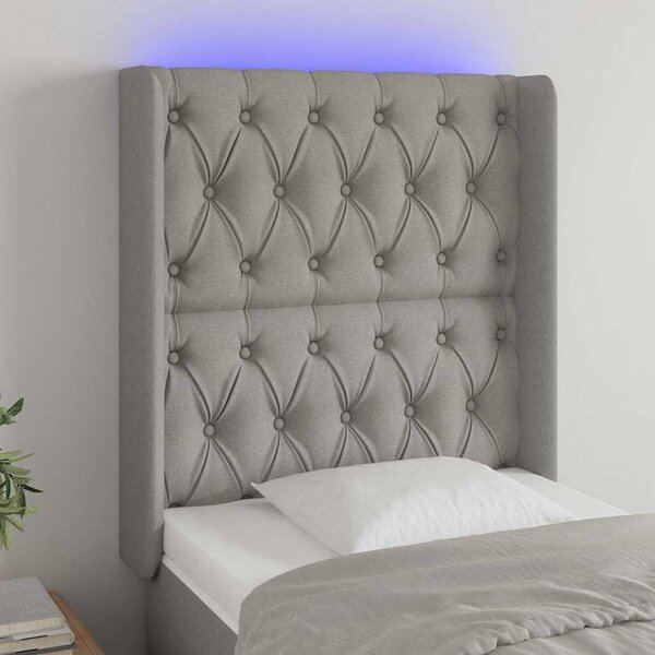 Čelo postele s LED světle šedé 83 x 16 x 118/128 cm textil 3124358