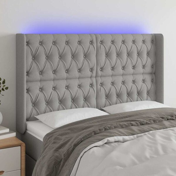 Čelo postele s LED světle šedé 147x16x118/128 cm textil 3124382