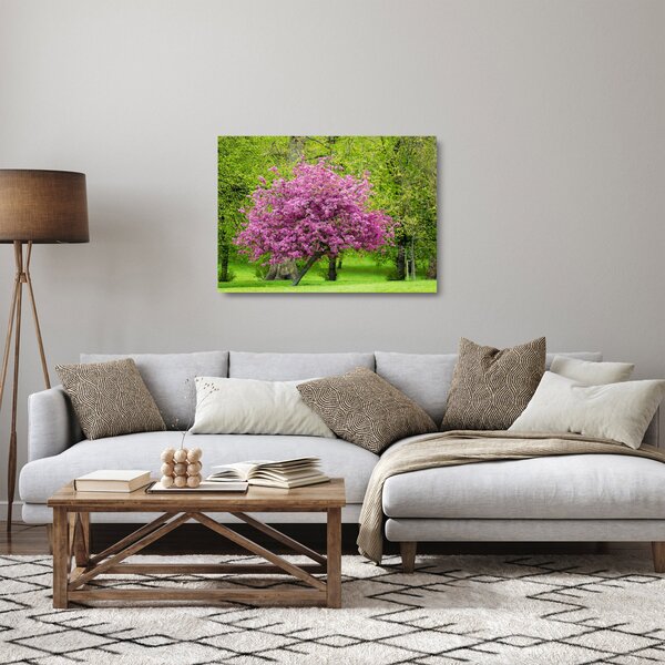 Skleněný obraz rozkvetlého stromu na louce (70x50 cm)