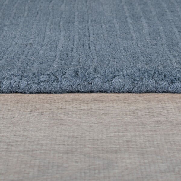 Tmavě modrý ručně tkaný vlněný koberec 120x170 cm Textured Wool Border – Flair Rugs