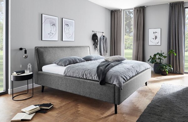Šedá látková dvoulůžková postel Meise Möbel Frieda 180 x 200 cm s černou podnoží