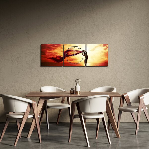 Obraz - Silueta ženy v západu slunce (s hodinami) (90x30 cm)