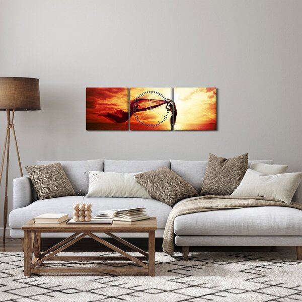 Obraz - Silueta ženy v západu slunce (s hodinami) (90x30 cm)