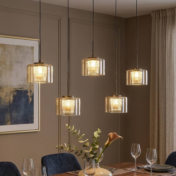 Searchlight LED závěsné světlo Tumblers, 5žárovkové, dlouhé, bronzové, sklo, 3 000 K, stmívatelný, Krémová / jantar, Obývací pokoj / jídelna, Hliník