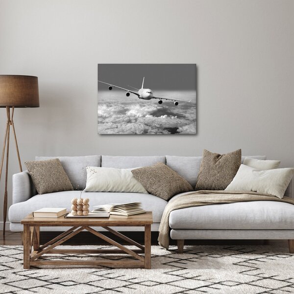 Obraz - Letadlo v oblacích, černobílé (70x50 cm)