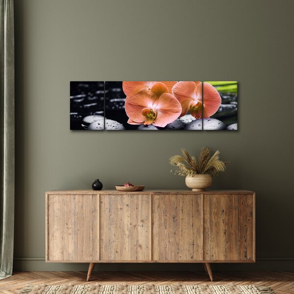 Obraz - Oranžová orchidej s palmovými listy (170x50 cm)