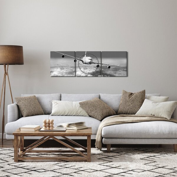 Obraz - Letadlo v oblacích, černobílé (s hodinami) (90x30 cm)