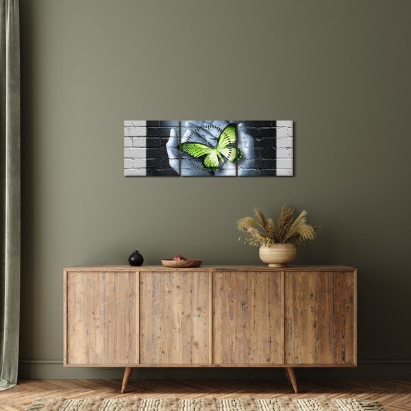 Obraz - Zelený motýl ve zdi (s hodinami) (90x30 cm)