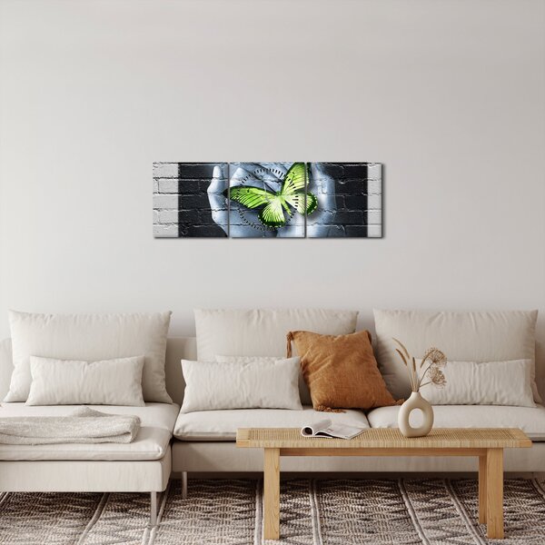 Obraz - Zelený motýl ve zdi (s hodinami) (90x30 cm)