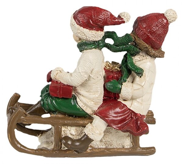 Dekorativní figurka děti na sáních ve vánočních čepicích – 12x6x11
