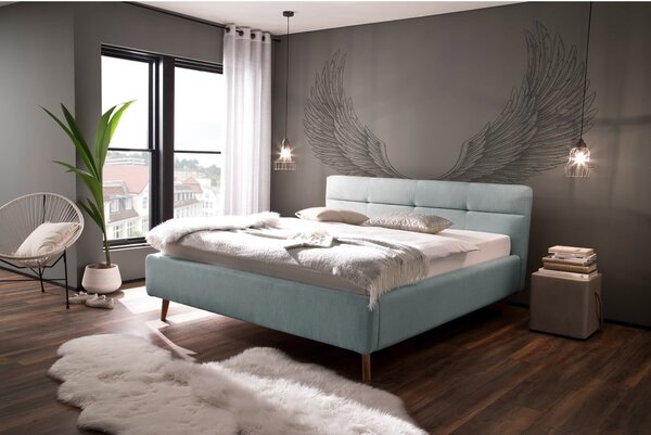 Světle modrá čalouněná dvoulůžková postel s úložným prostorem s roštem 180x200 cm Lotte – Meise Möbel