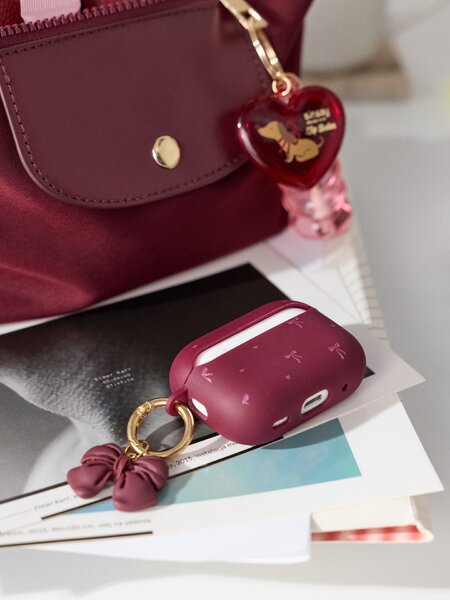 Sinsay - Pouzdro na AirPods Pro 2. generace s motivem mašle - kaštanová